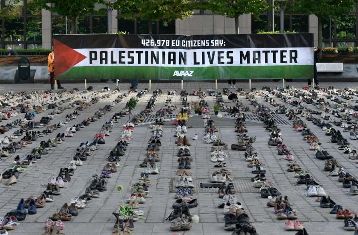 تضامنا مع فلسطين .. آلاف الأحذية أمام مقرّ مجلس الاتحاد الأوروبي ببروكسل -(صو وفيديو)